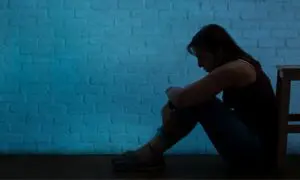 woman in the darkness in need of on demand mental health services