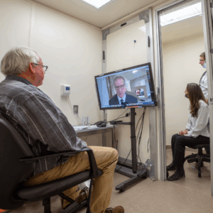 A man talking to a psychiatrist on tv.
