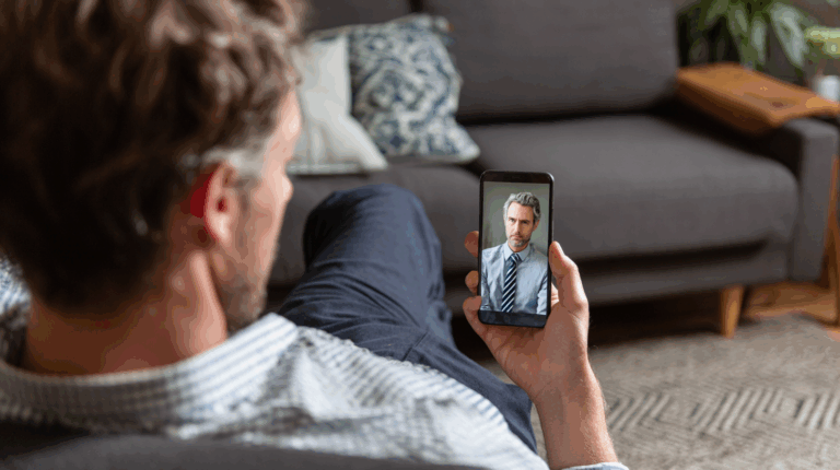 A man speaking to a doctor on his cell phone.