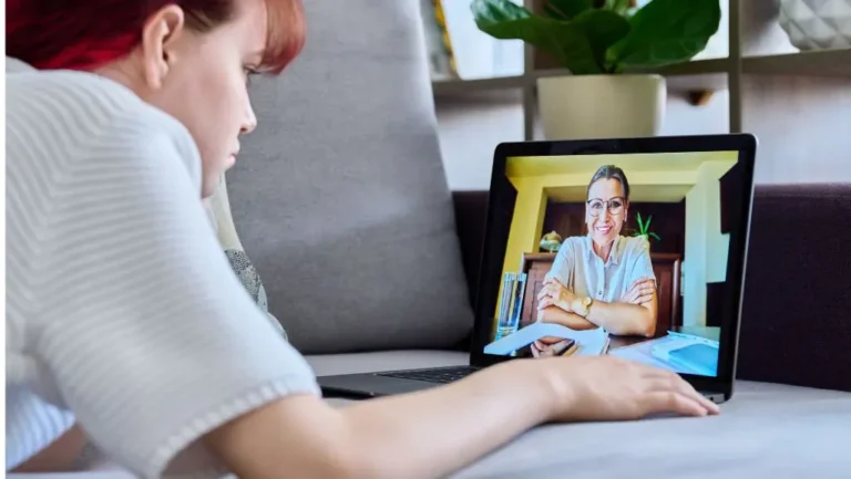 Woman learning about the types of healthcare providers available with telepsychiatry.