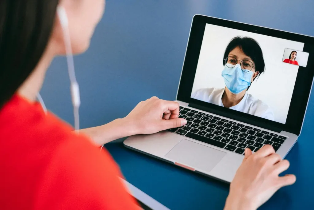 Patient on the phone with a telepsychiatrist after learning about the best telepsychiatry companies.