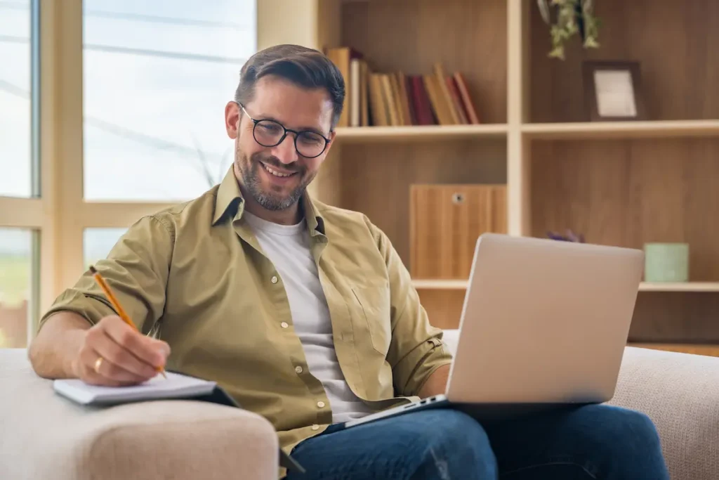 Man taking part of adult psychiatry services online