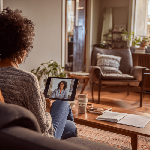 u3291467371_an_african_american_woman_is_sitting_on_a_couch_i_7369794c-64db-4d71-9e45-3d1f5912420c_3